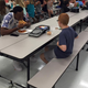 Travis Rudolph and middle schooler Bo Paske having lunch
Facebook